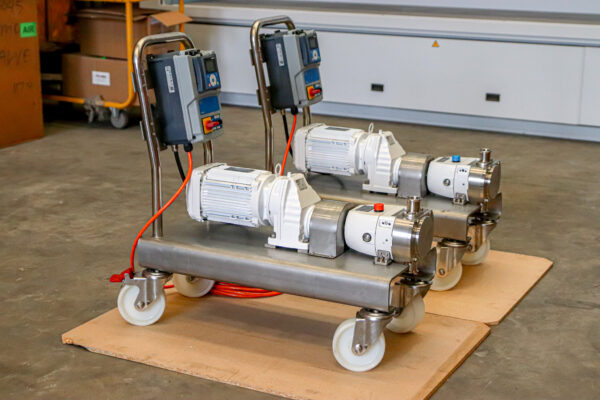 Side view of 2 Jabsco Lobe pumps on trollleys, will be used for pumping a blood and saline mix